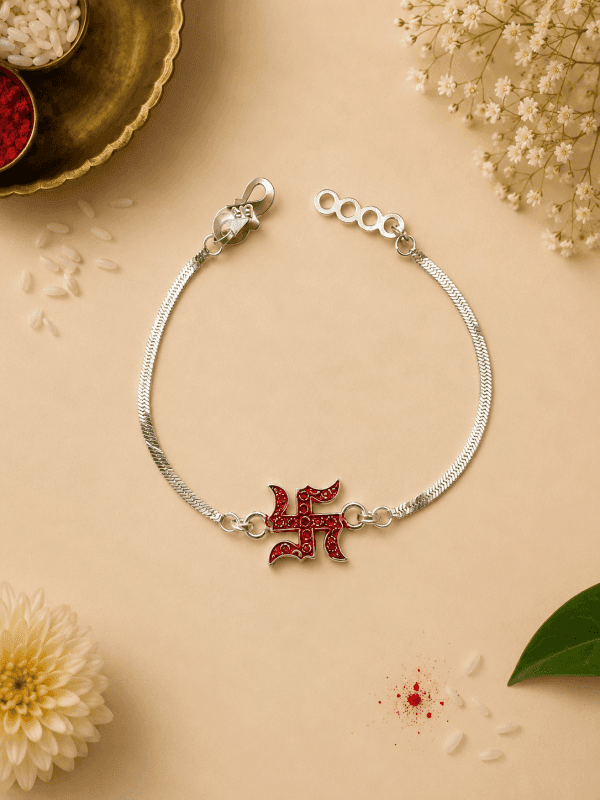 divine swastik blessings – designer silver plated rakhi by Lawanyam - View 1